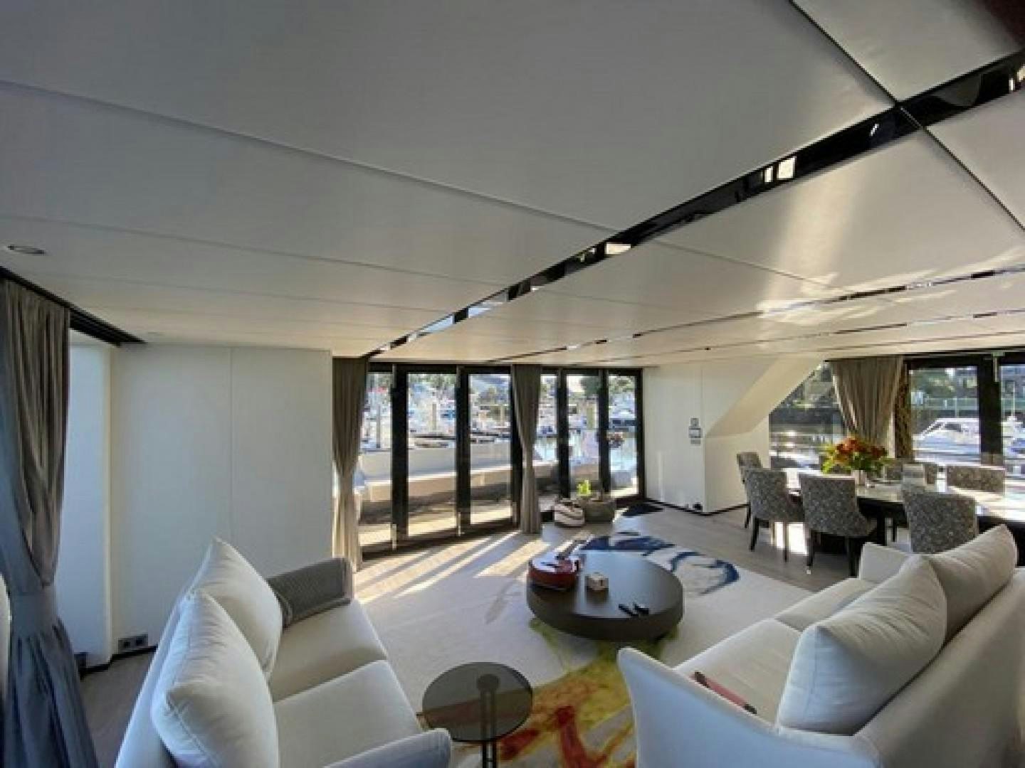 a living room with a large glass door aboard EMMILIZA Yacht for Sale