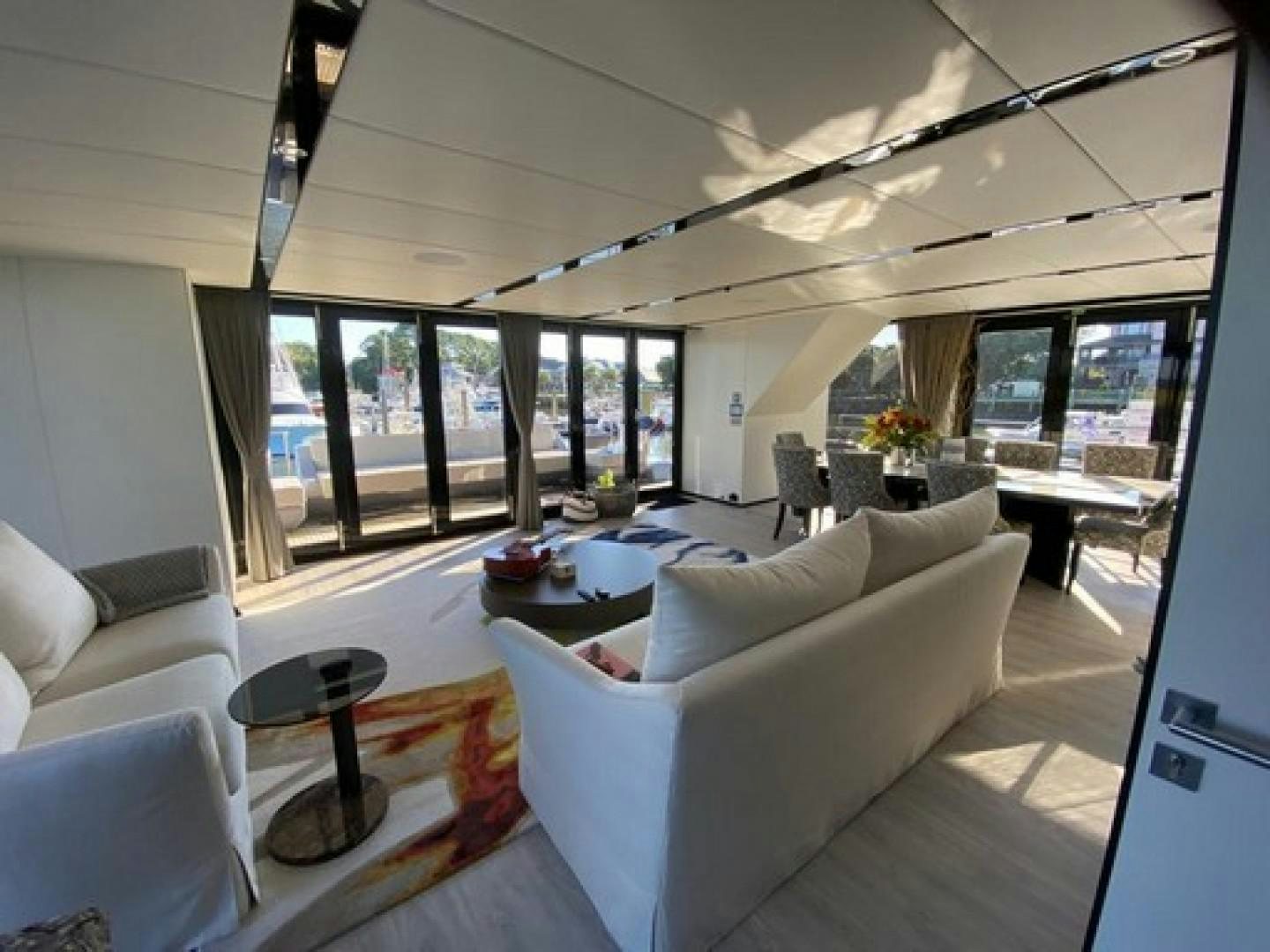 a living room with a large window aboard EMMILIZA Yacht for Sale