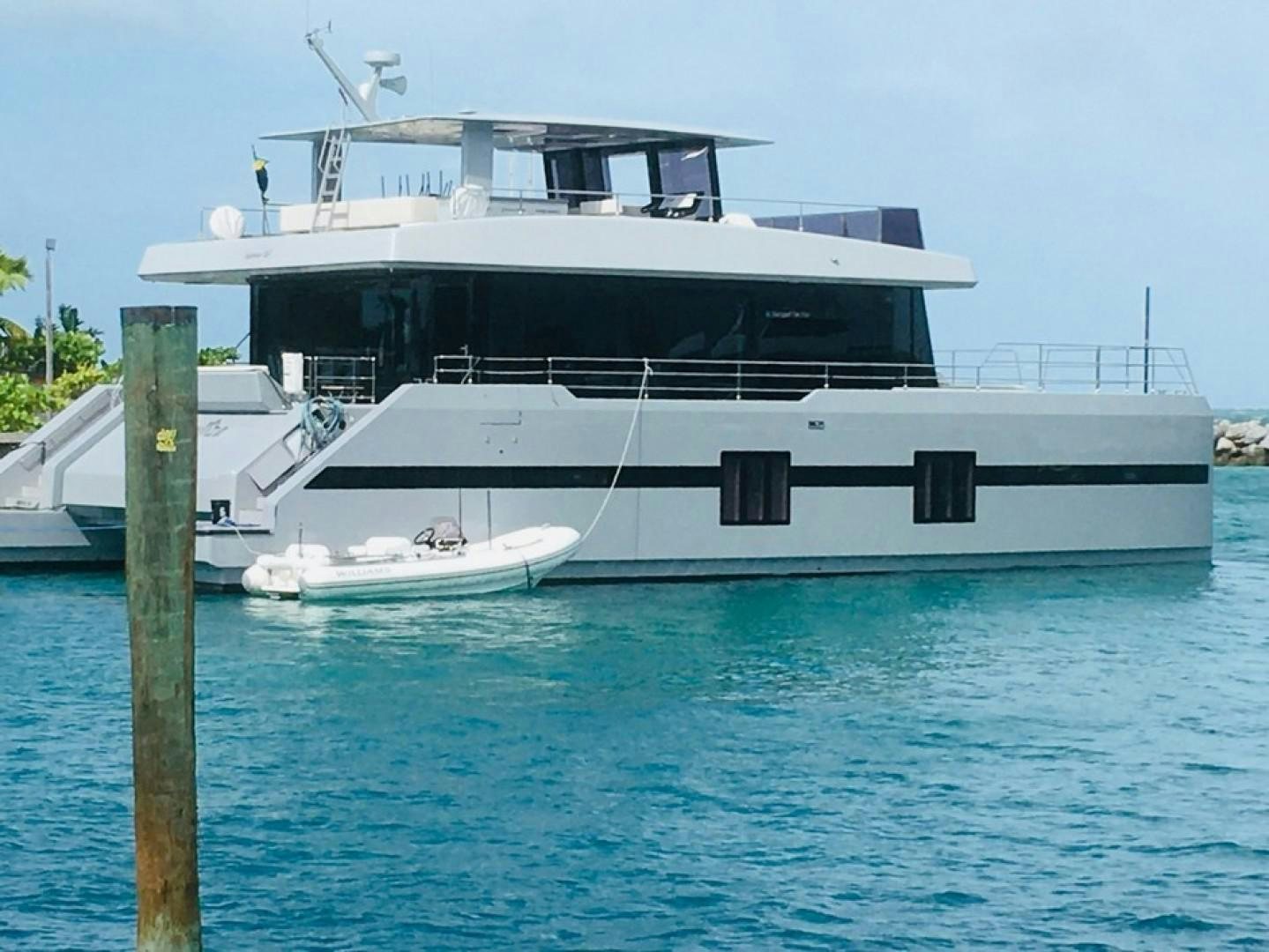 a large white boat in the water aboard EMMILIZA Yacht for Sale