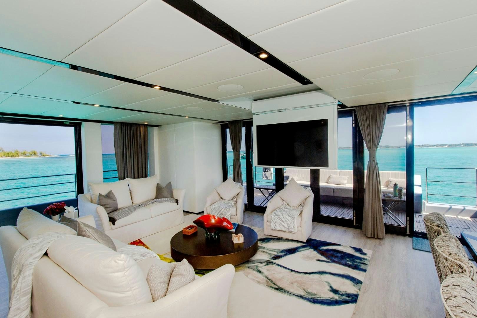 a living room with a large window aboard EMMILIZA Yacht for Sale
