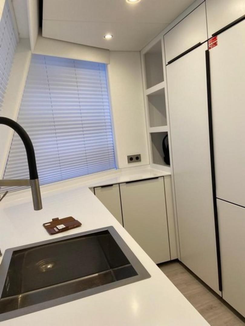 a kitchen with a stove and cabinets aboard EMMILIZA Yacht for Sale