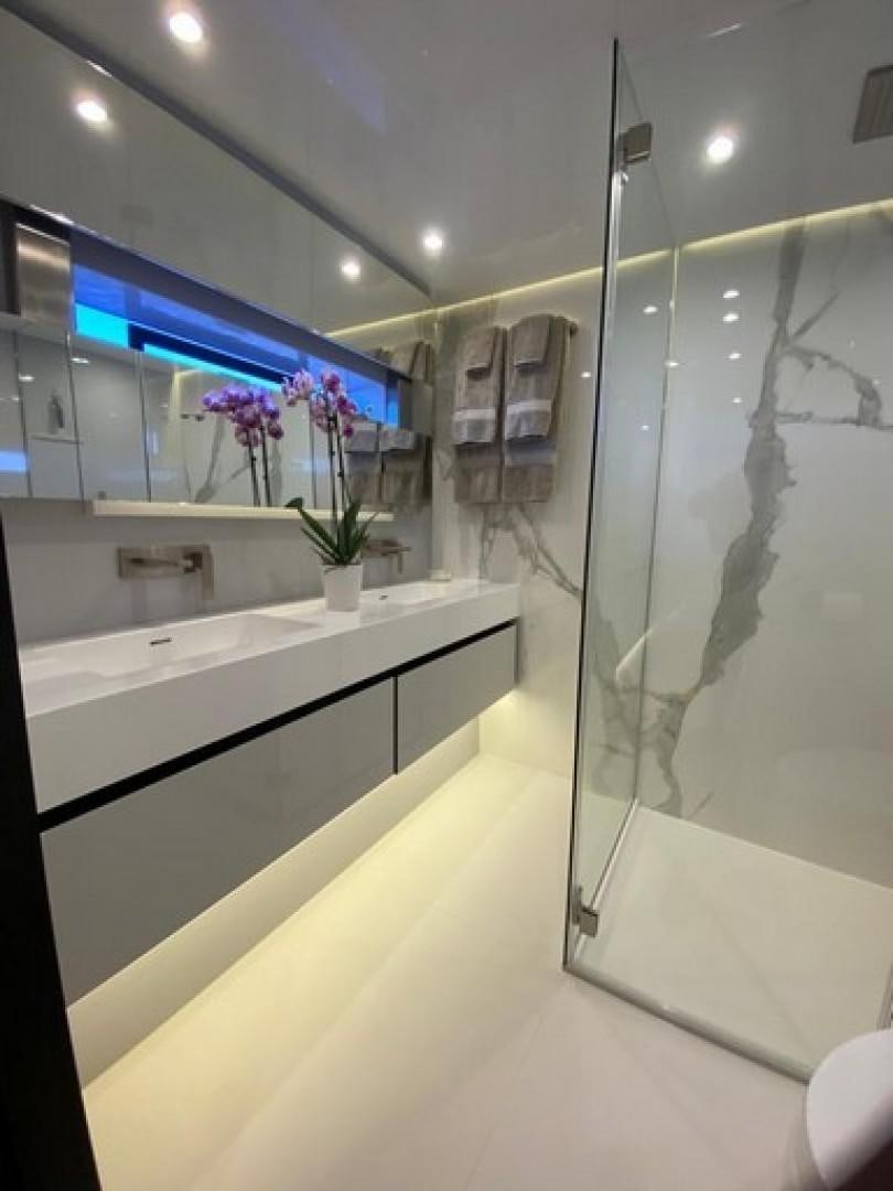 a bathroom with a glass shower aboard EMMILIZA Yacht for Sale
