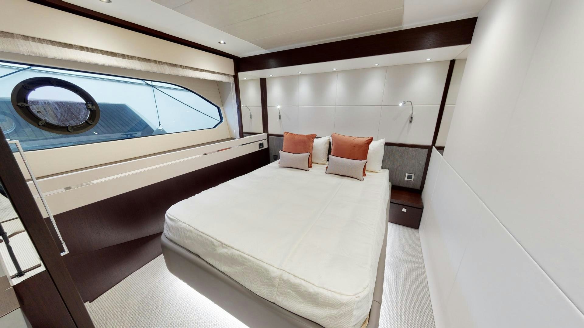 a room with a bed and a window aboard MOONLIGHT Yacht for Sale