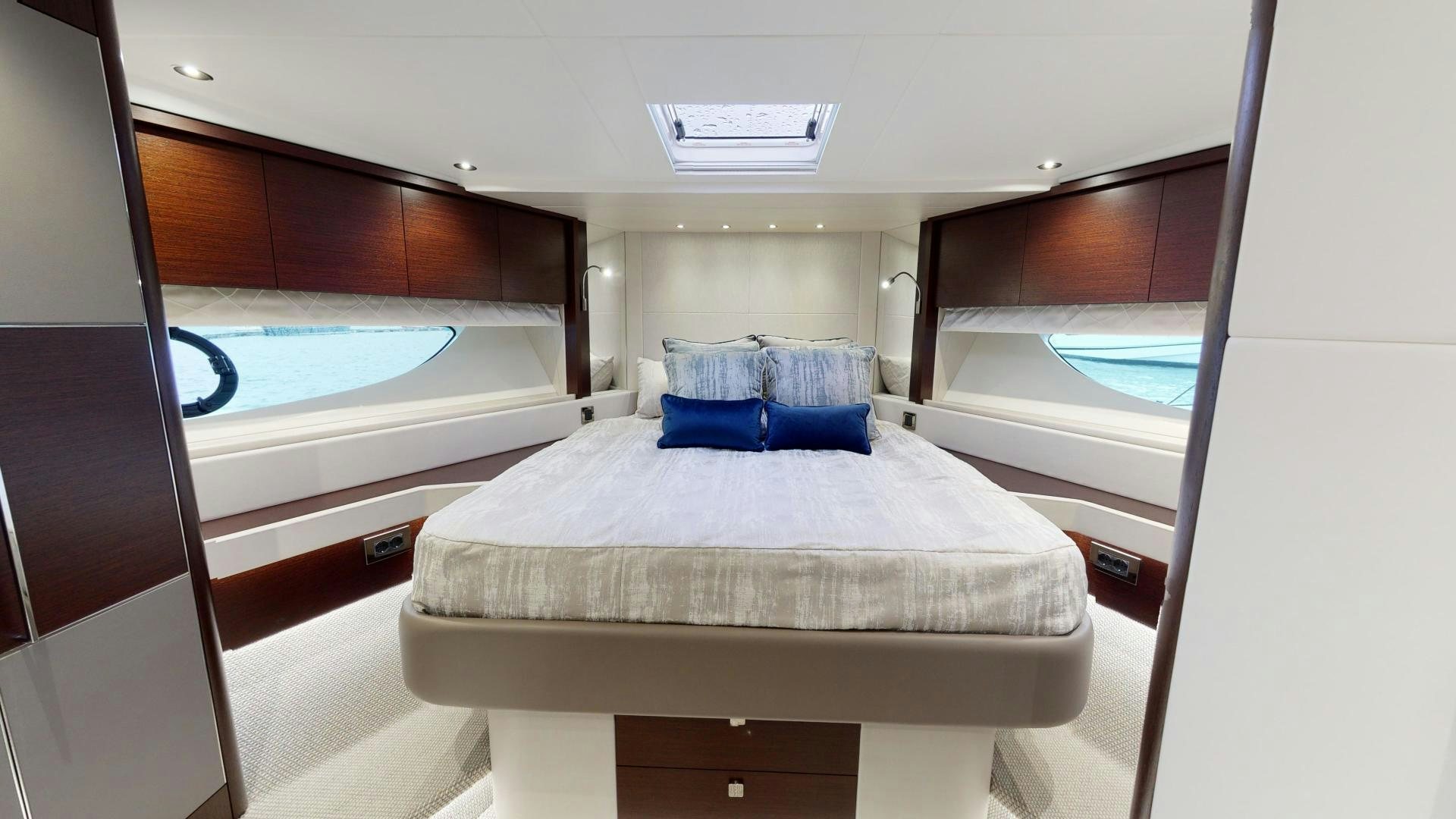 a room with a bed and a window aboard MOONLIGHT Yacht for Sale