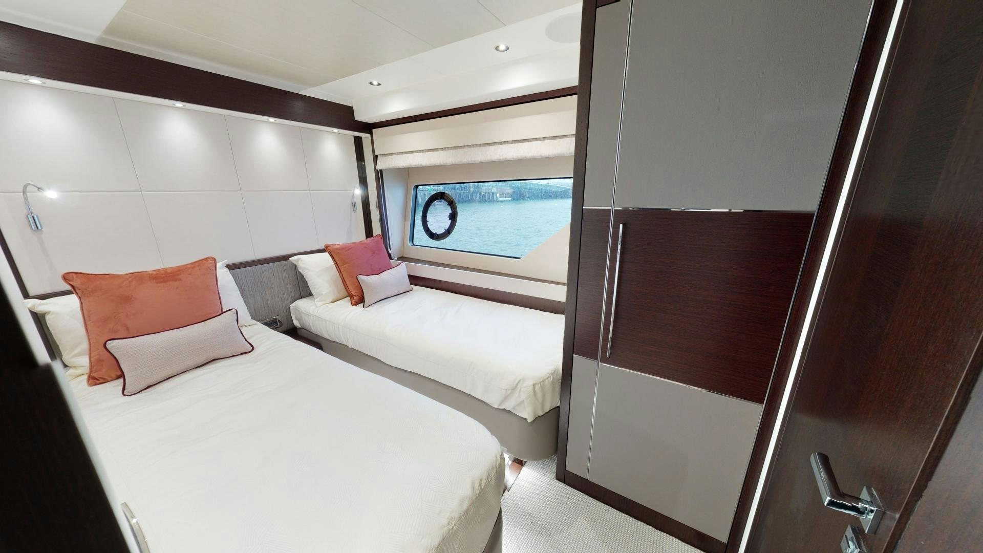 a room with a bed and a window aboard MOONLIGHT Yacht for Sale
