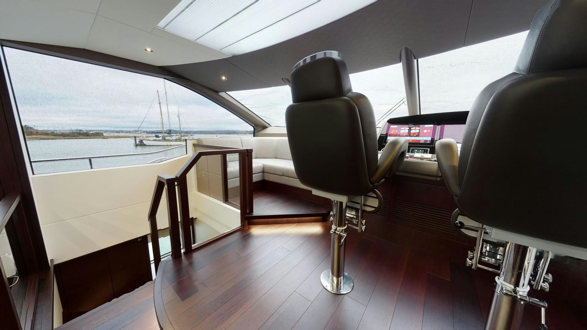 a room with a chair and a table and chairs aboard MOONLIGHT Yacht for Sale
