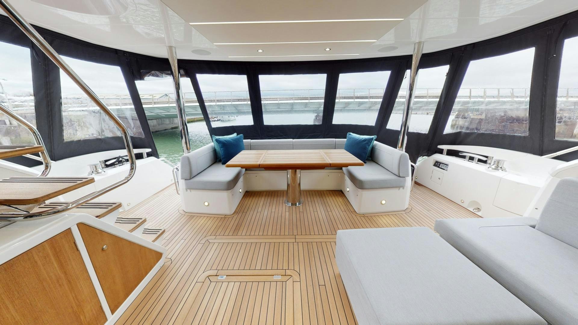 a room with a couch and a table and chairs aboard MOONLIGHT Yacht for Sale