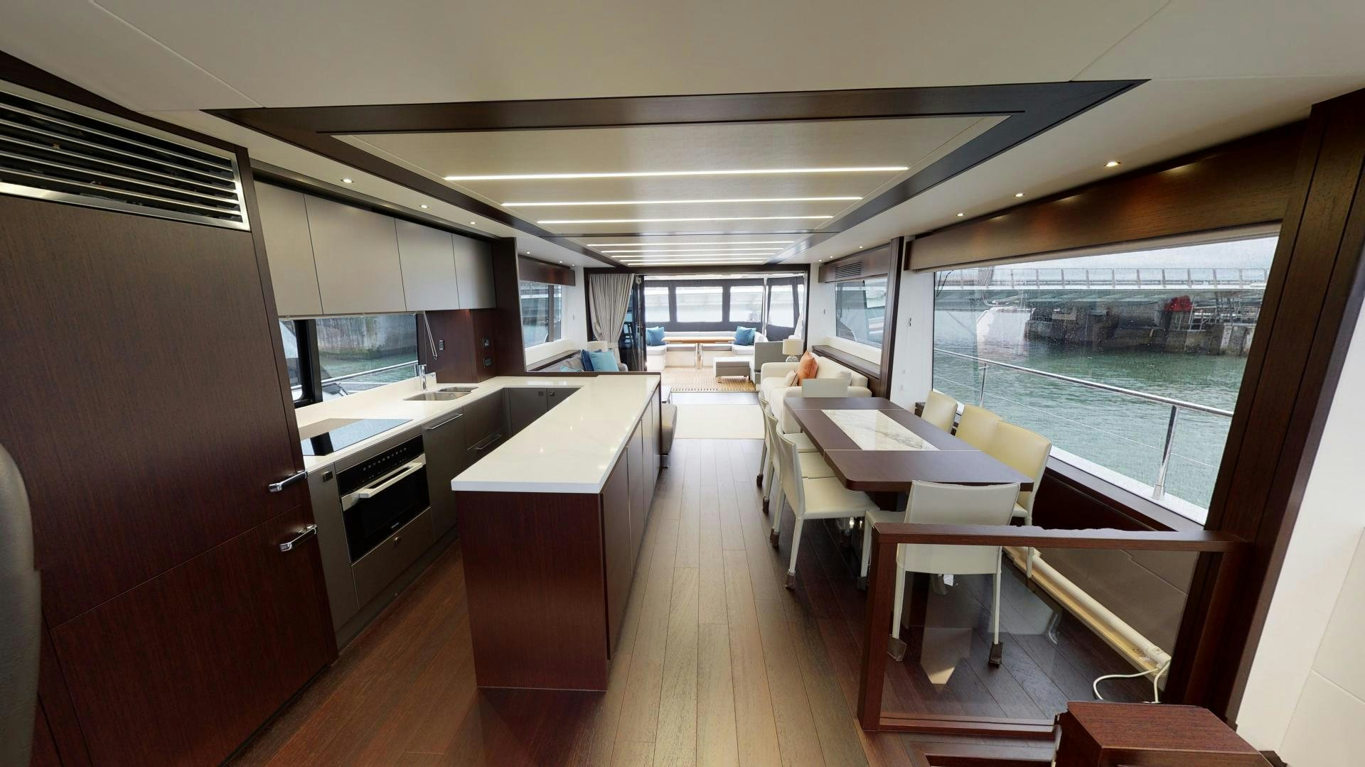 a room with a table and chairs aboard MOONLIGHT Yacht for Sale