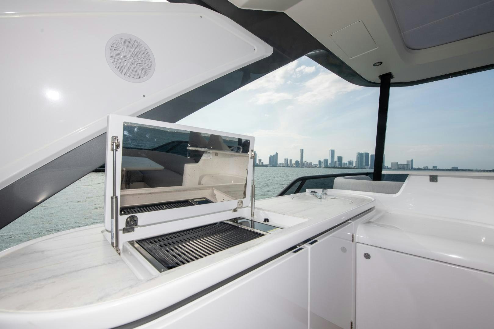 a white car on a white car aboard CRIMSON Yacht for Sale