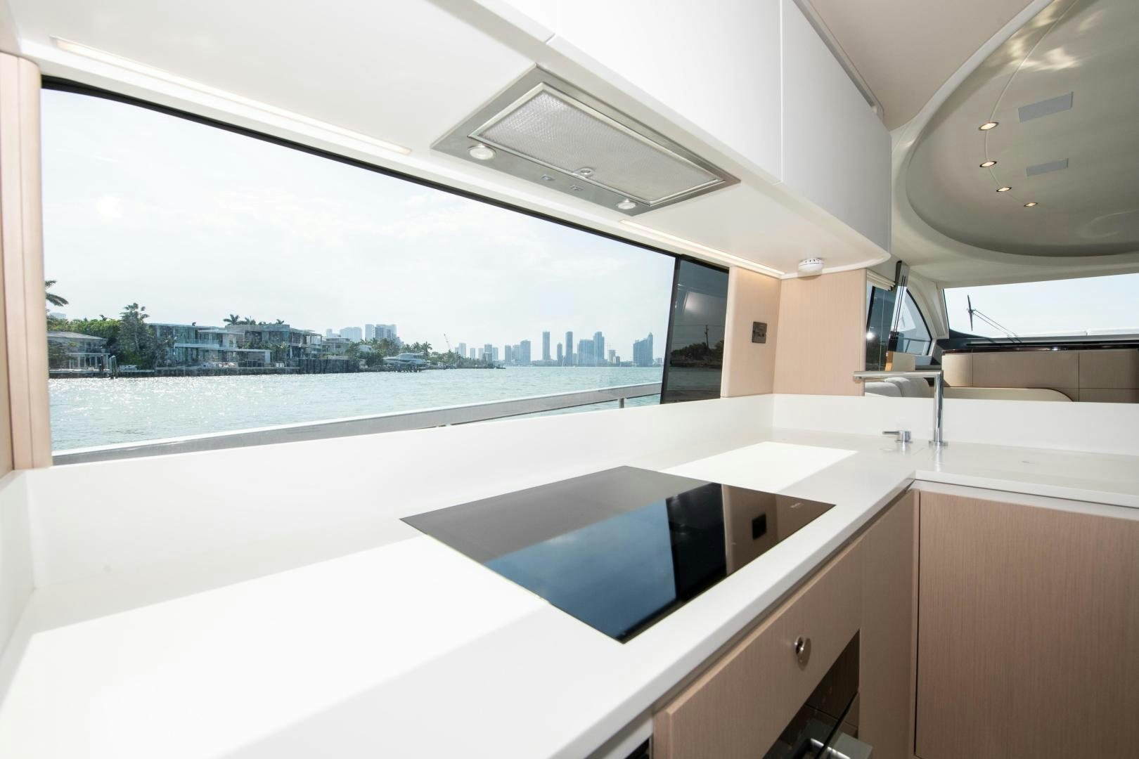 a room with a large window and a view of a city aboard CRIMSON Yacht for Sale