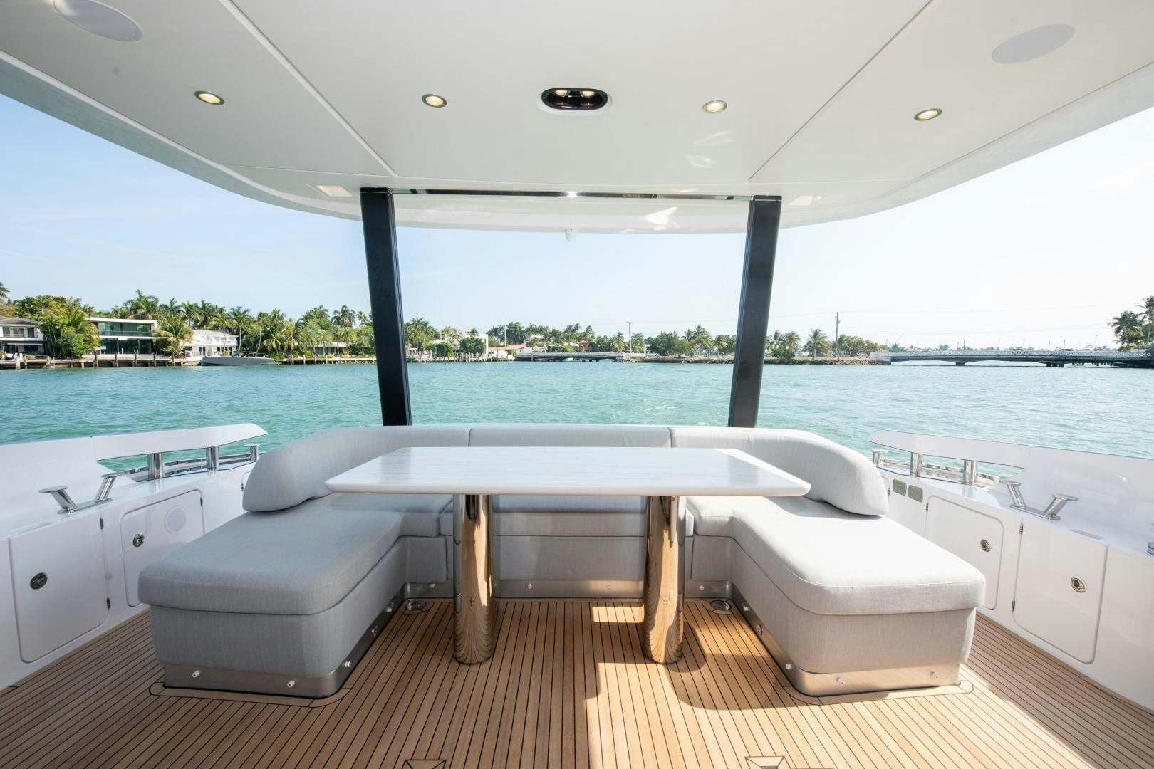 a room with a table and chairs aboard CRIMSON Yacht for Sale