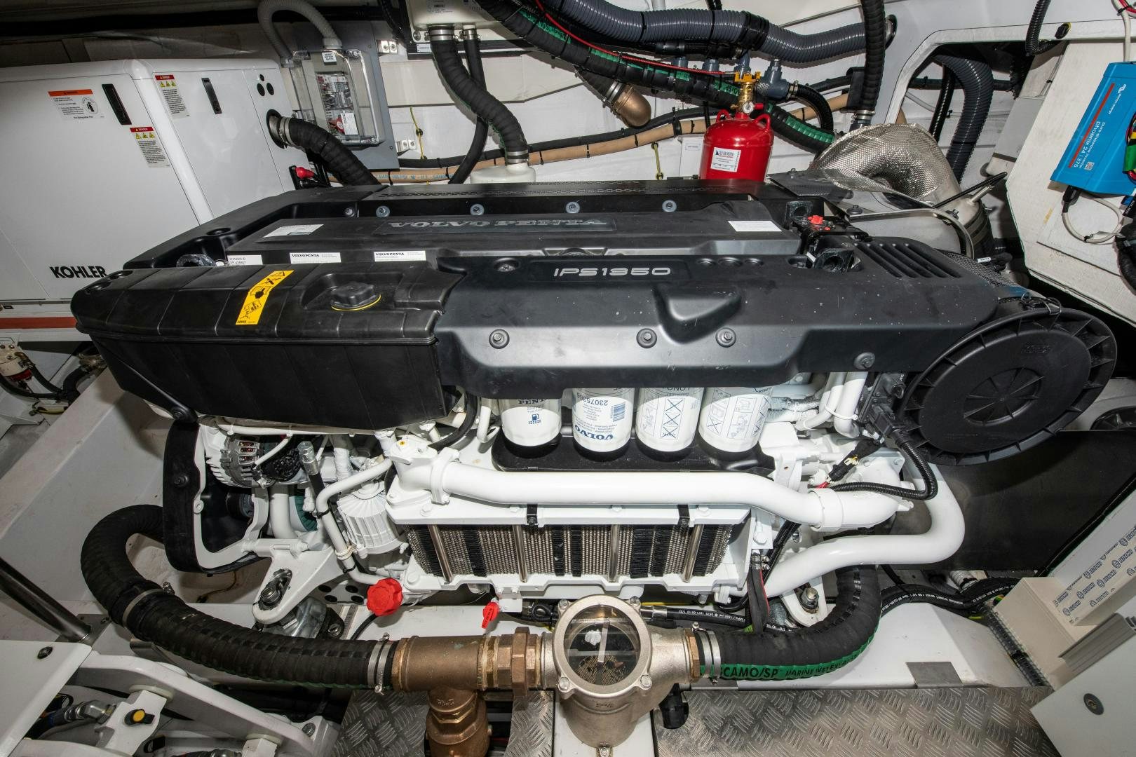 a black engine with a red and white engine aboard CRIMSON Yacht for Sale