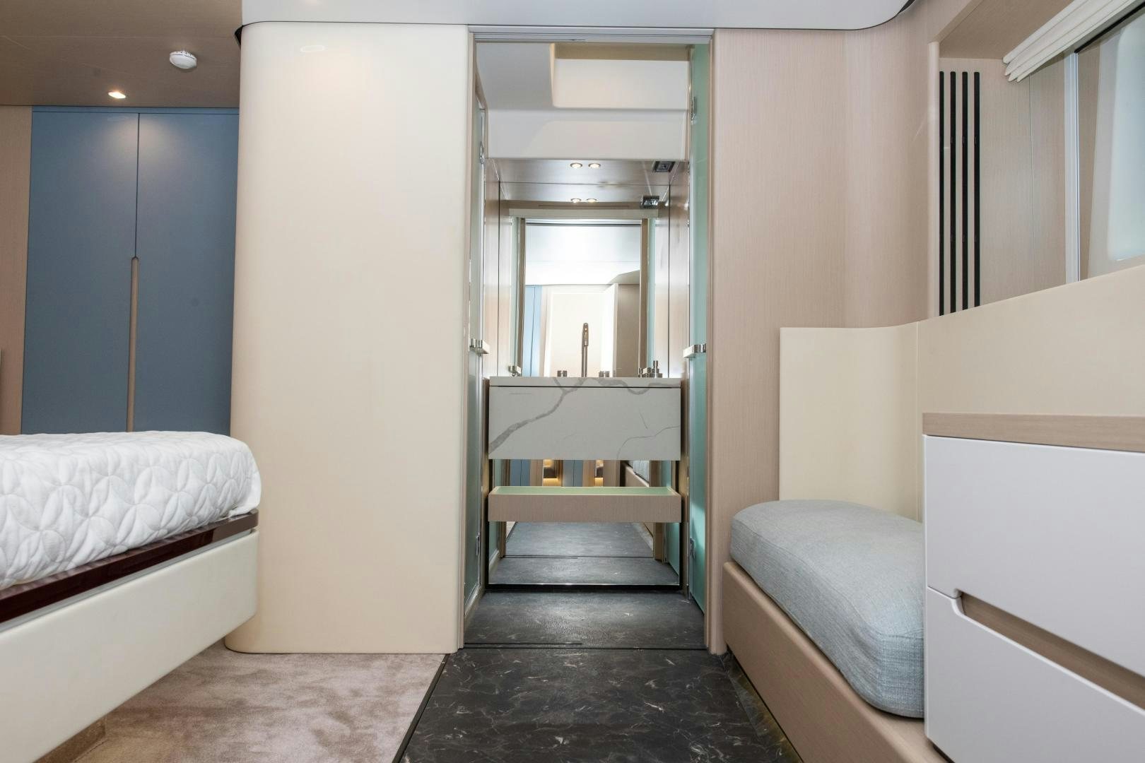 a room with a bed and a mirror aboard CRIMSON Yacht for Sale