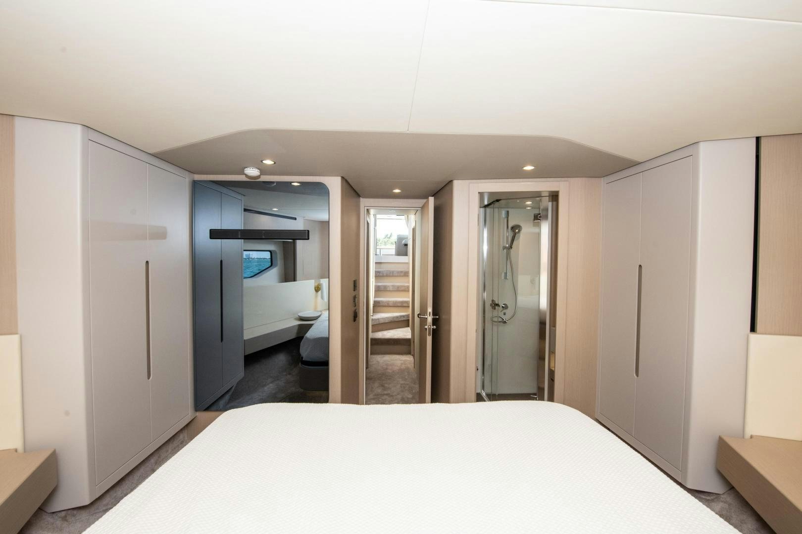 a large white bed in a room aboard CRIMSON Yacht for Sale