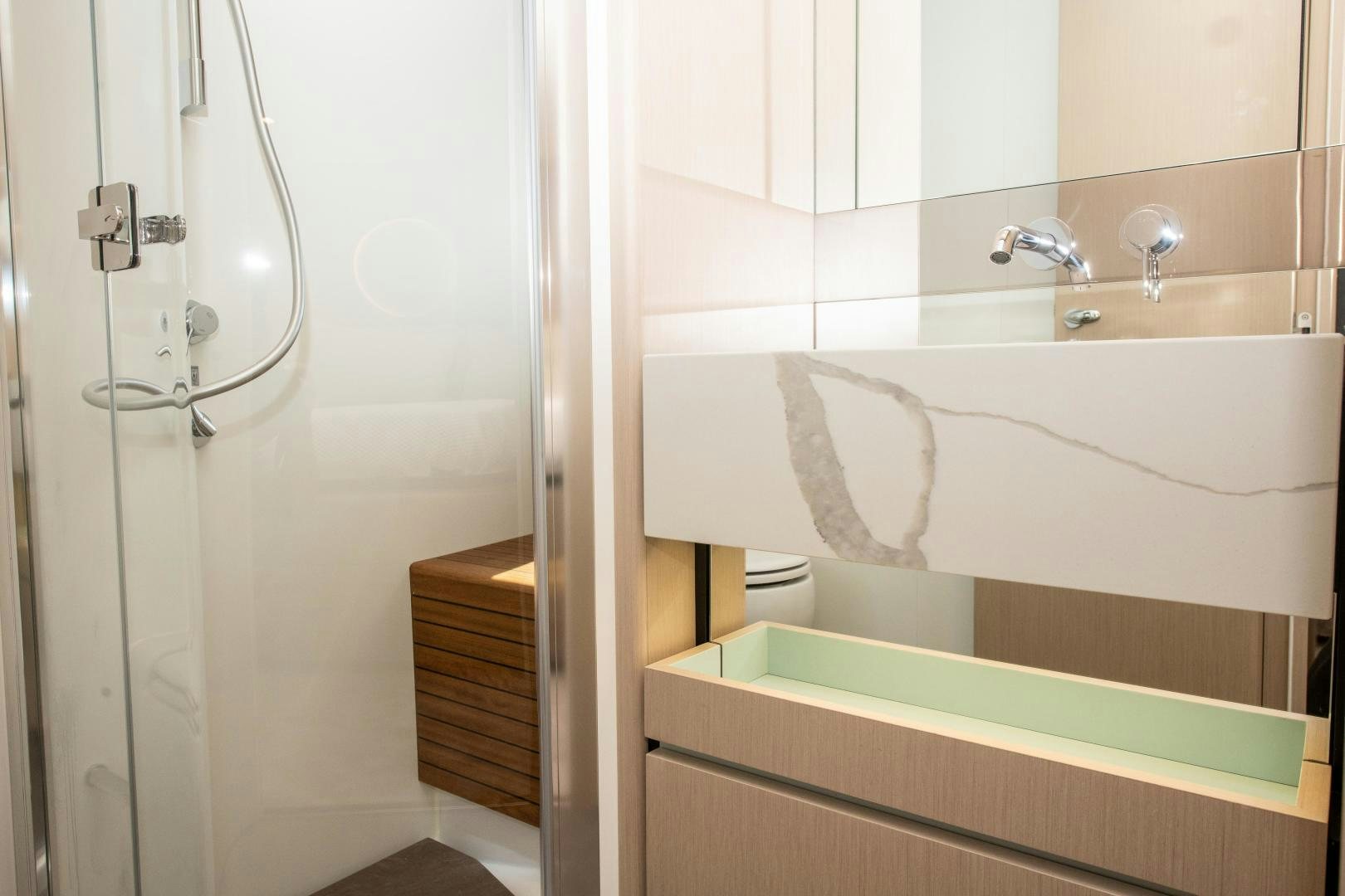 a bathroom with a bathtub and sink aboard CRIMSON Yacht for Sale