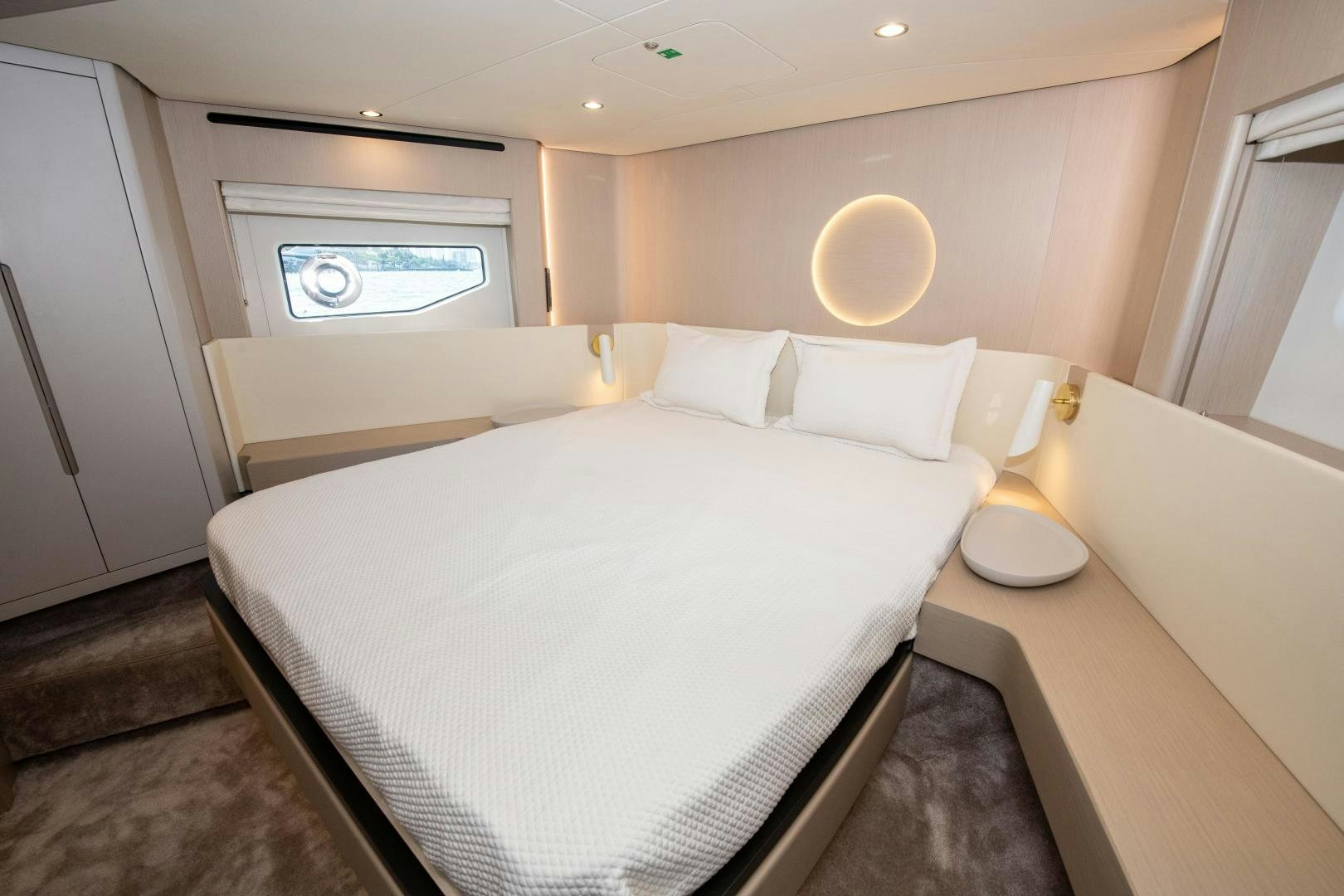 a room with a bed and a window aboard CRIMSON Yacht for Sale