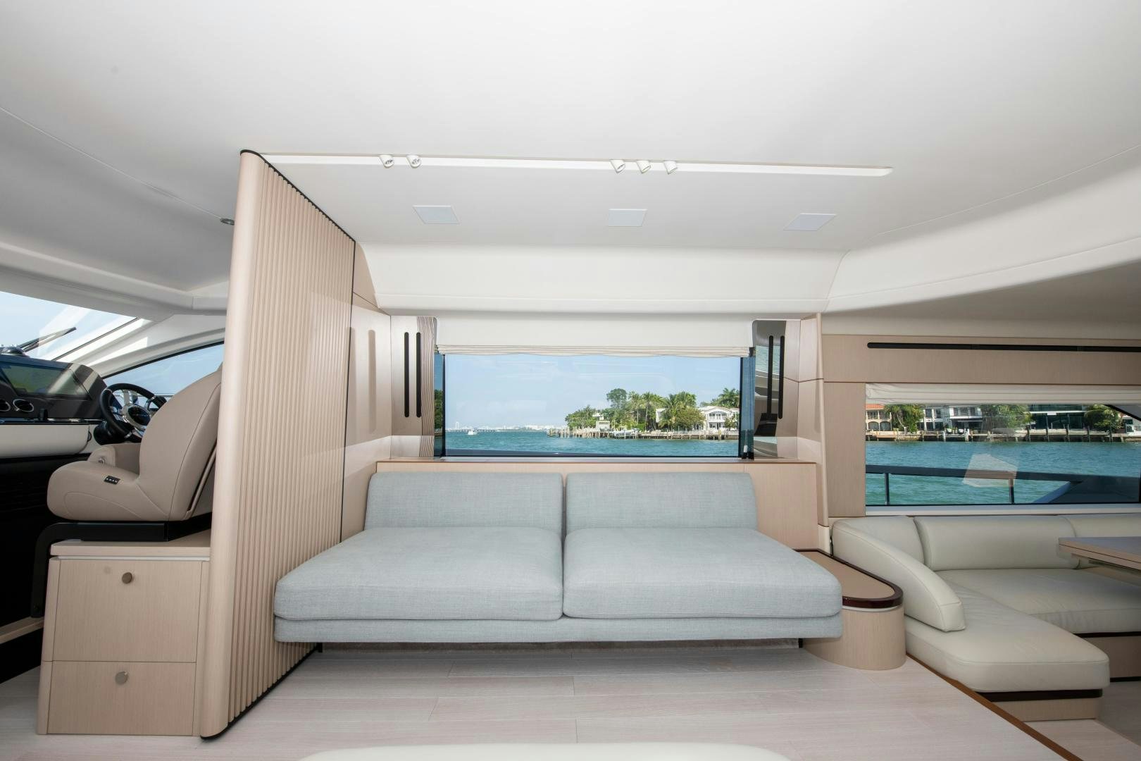 a room with a couch and a pool aboard CRIMSON Yacht for Sale