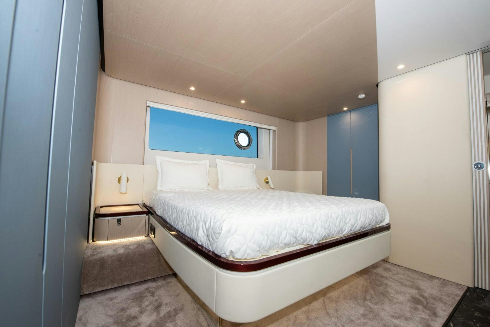 a bedroom with a bed aboard CRIMSON Yacht for Sale