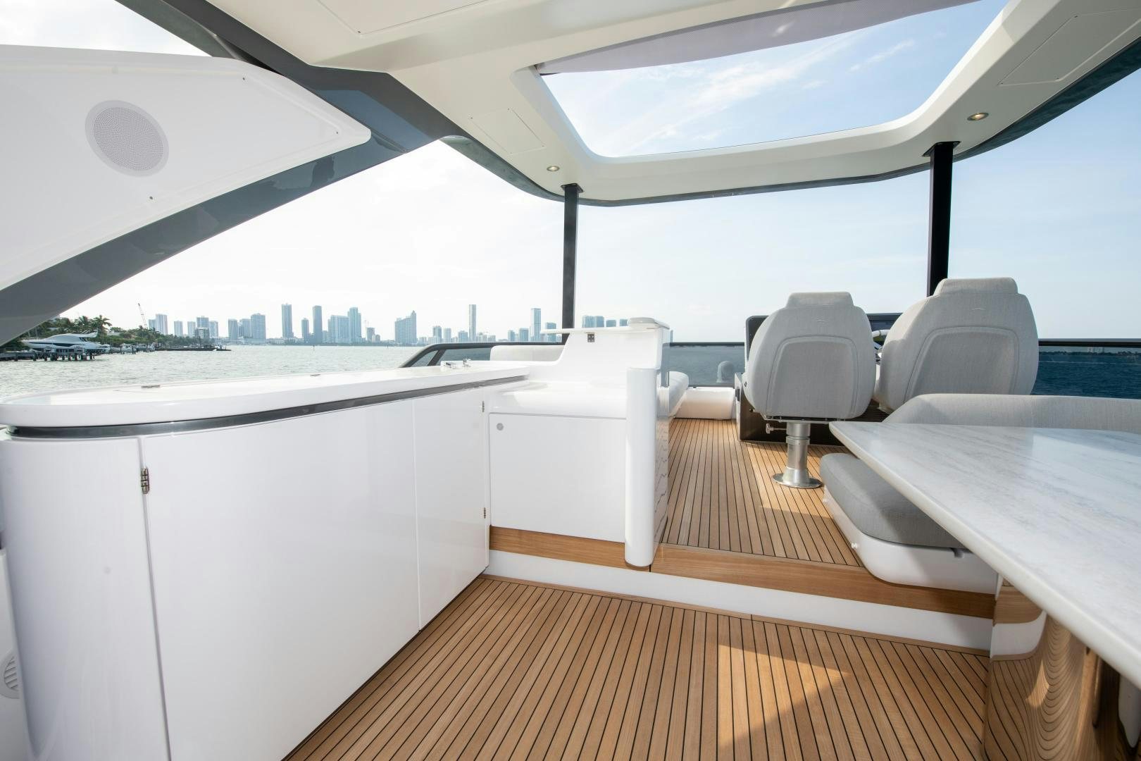 a room with a table and chairs aboard CRIMSON Yacht for Sale