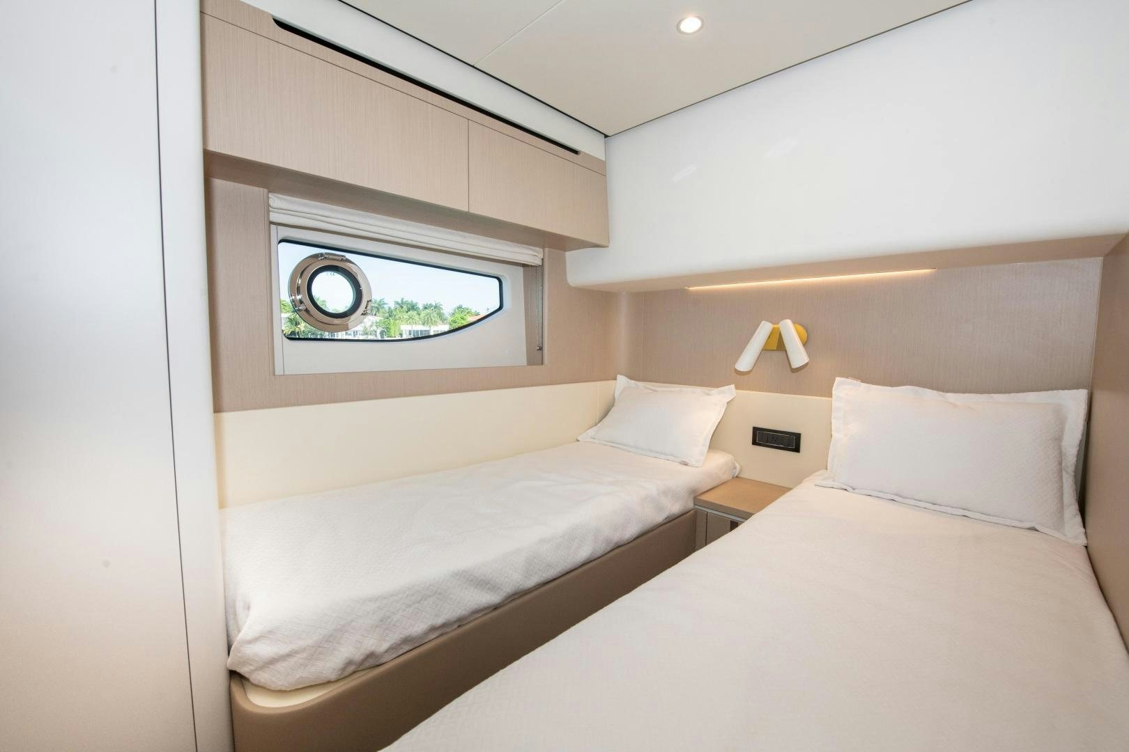 a room with two beds aboard CRIMSON Yacht for Sale