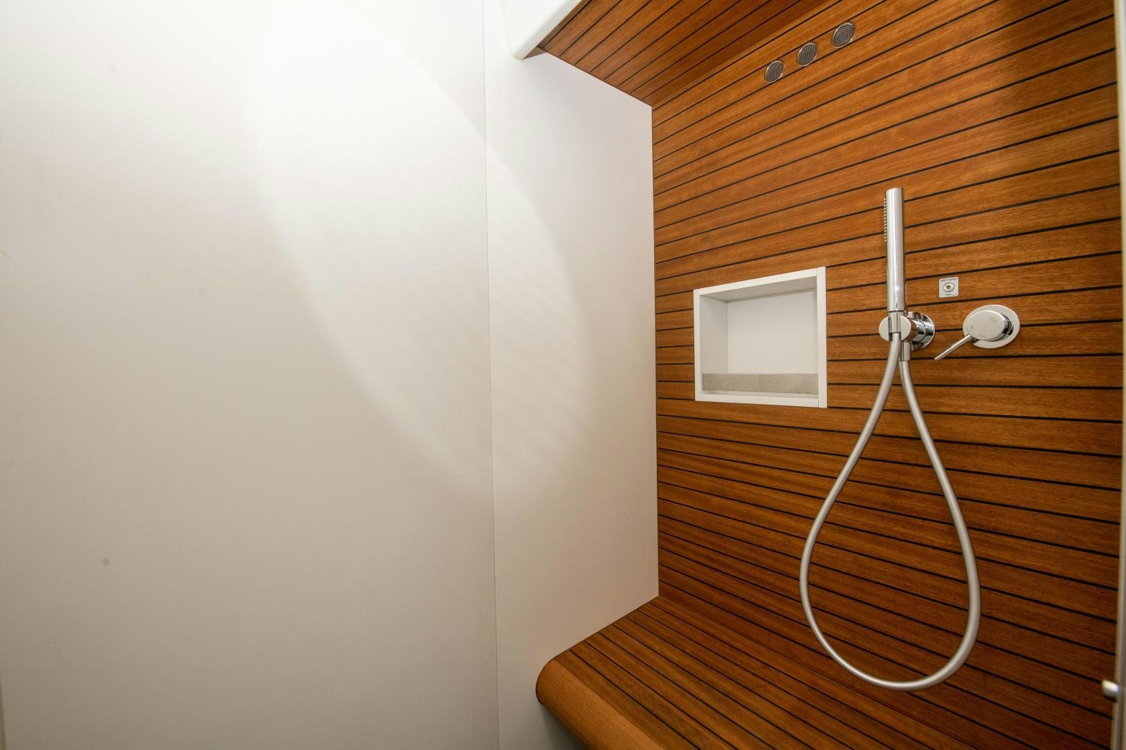 a white wall with a light switch aboard CRIMSON Yacht for Sale