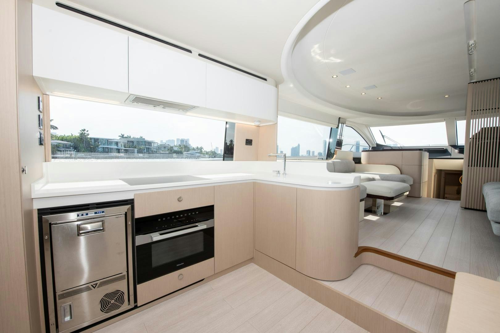 a kitchen with a large window aboard CRIMSON Yacht for Sale