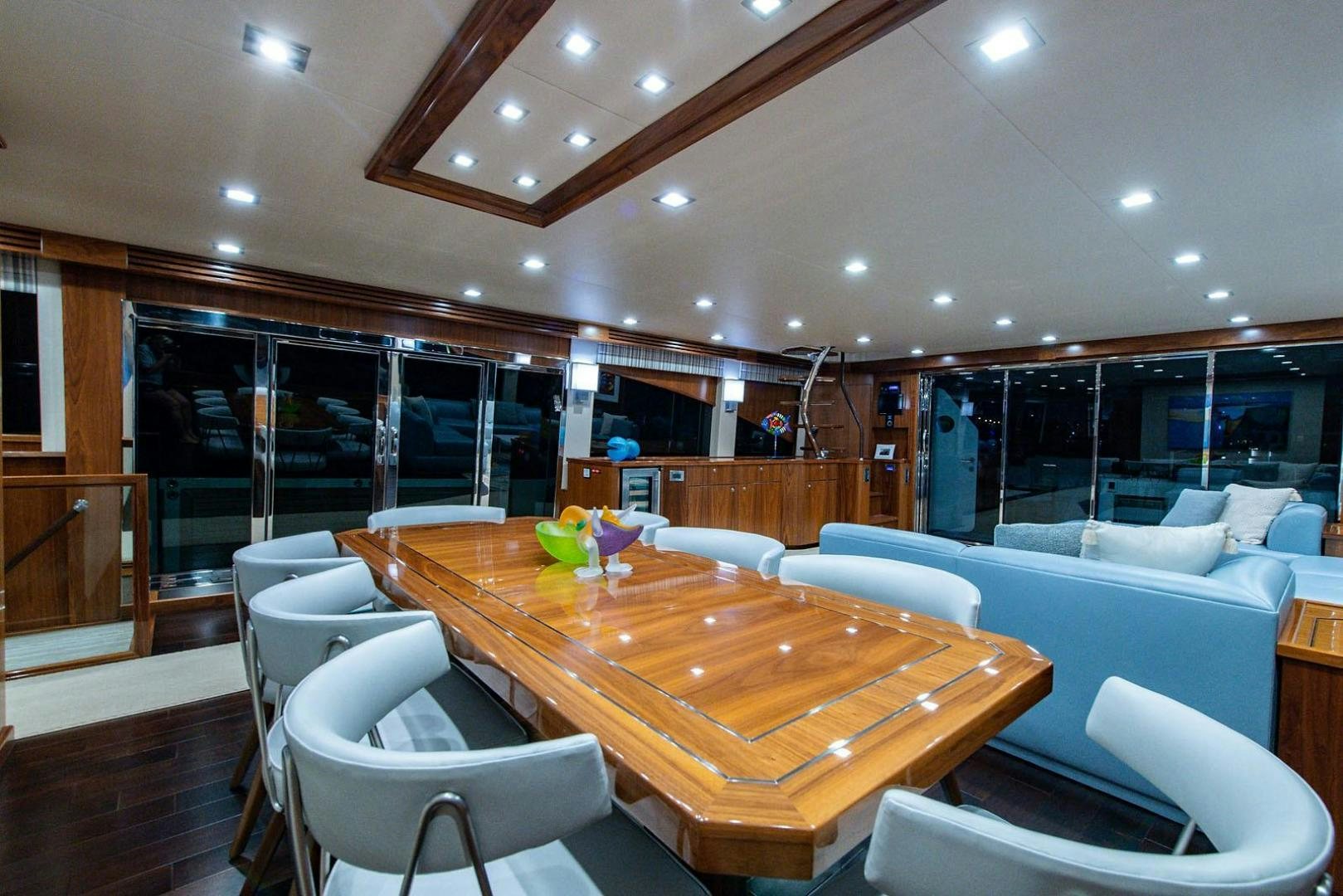 a room with a table and chairs aboard OBSESSION Yacht for Sale
