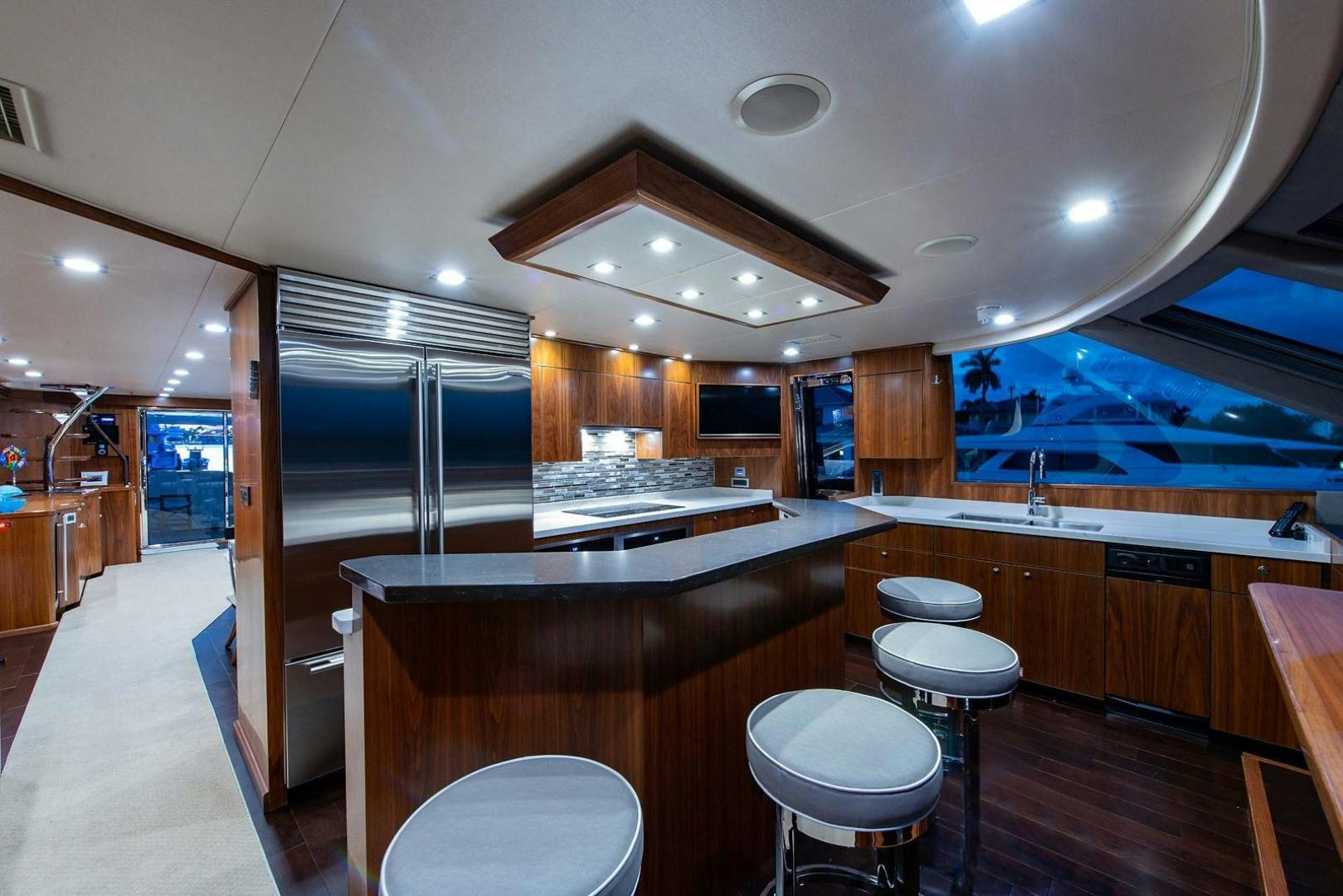 a kitchen with a large island aboard OBSESSION Yacht for Sale
