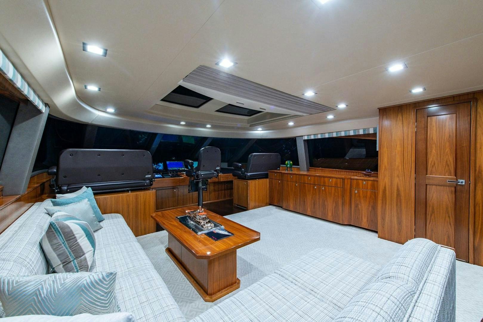 a room with a bed and a tv aboard OBSESSION Yacht for Sale