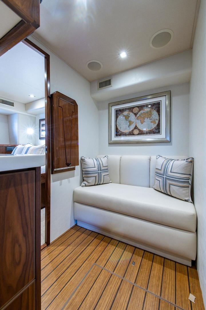 a living room with a couch aboard OBSESSION Yacht for Sale