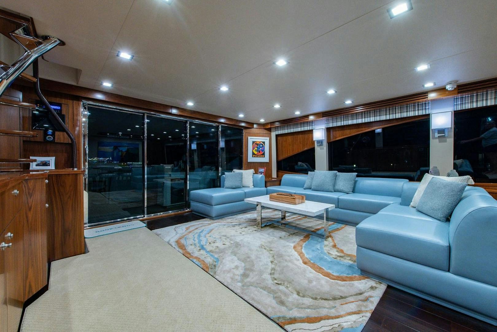 a living room with a large rug aboard OBSESSION Yacht for Sale