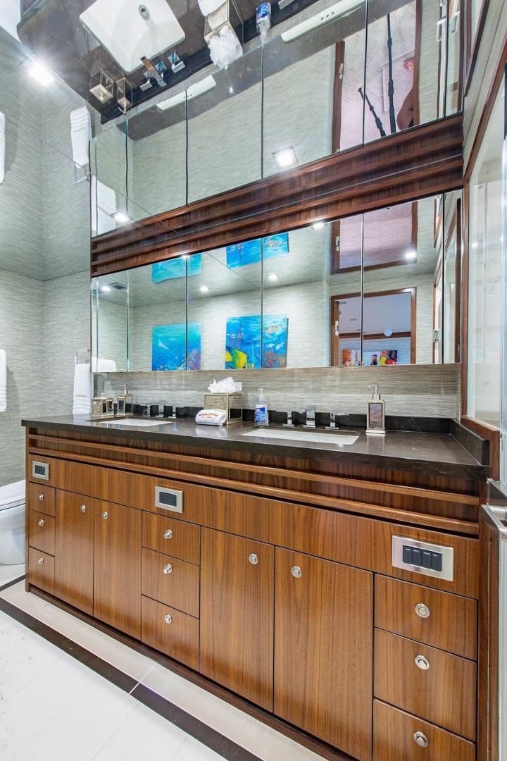 a bathroom with a large mirror aboard OBSESSION Yacht for Sale