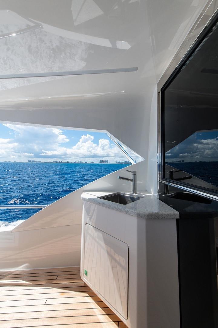 a room with a sink and a large window aboard OBSESSION Yacht for Sale