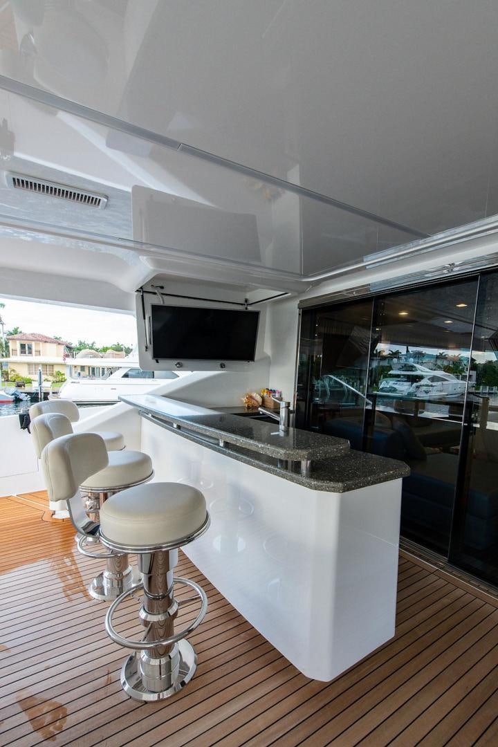 a room with a table and chairs aboard OBSESSION Yacht for Sale