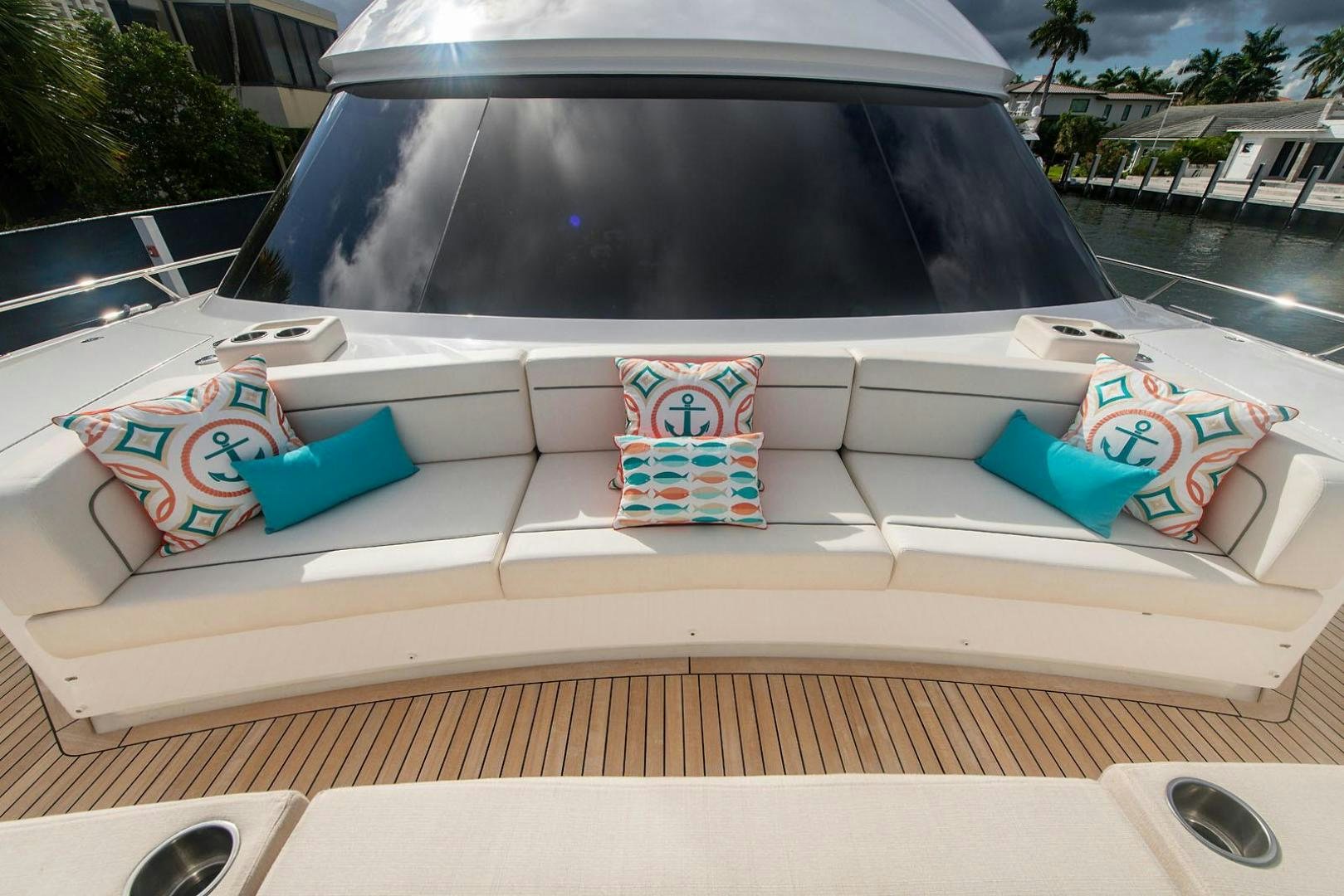 a boat with a sign on the front aboard OBSESSION Yacht for Sale