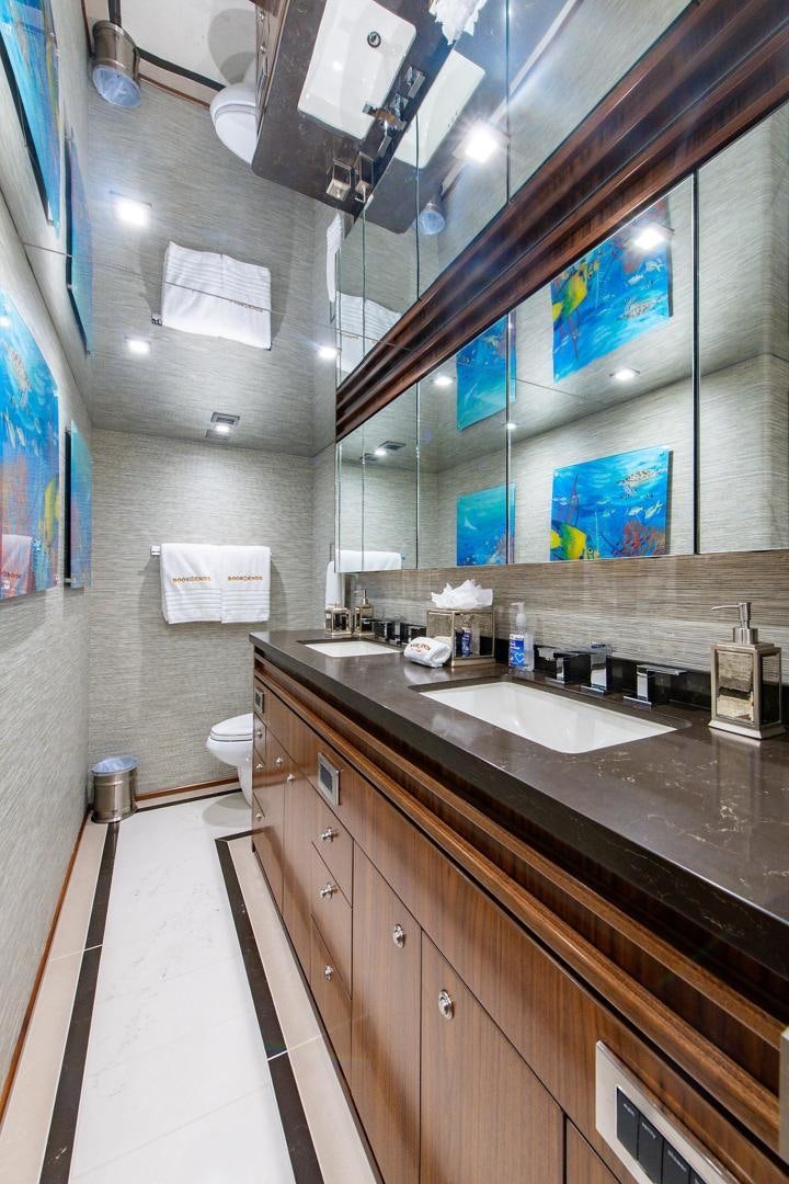 a bathroom with a large mirror aboard OBSESSION Yacht for Sale