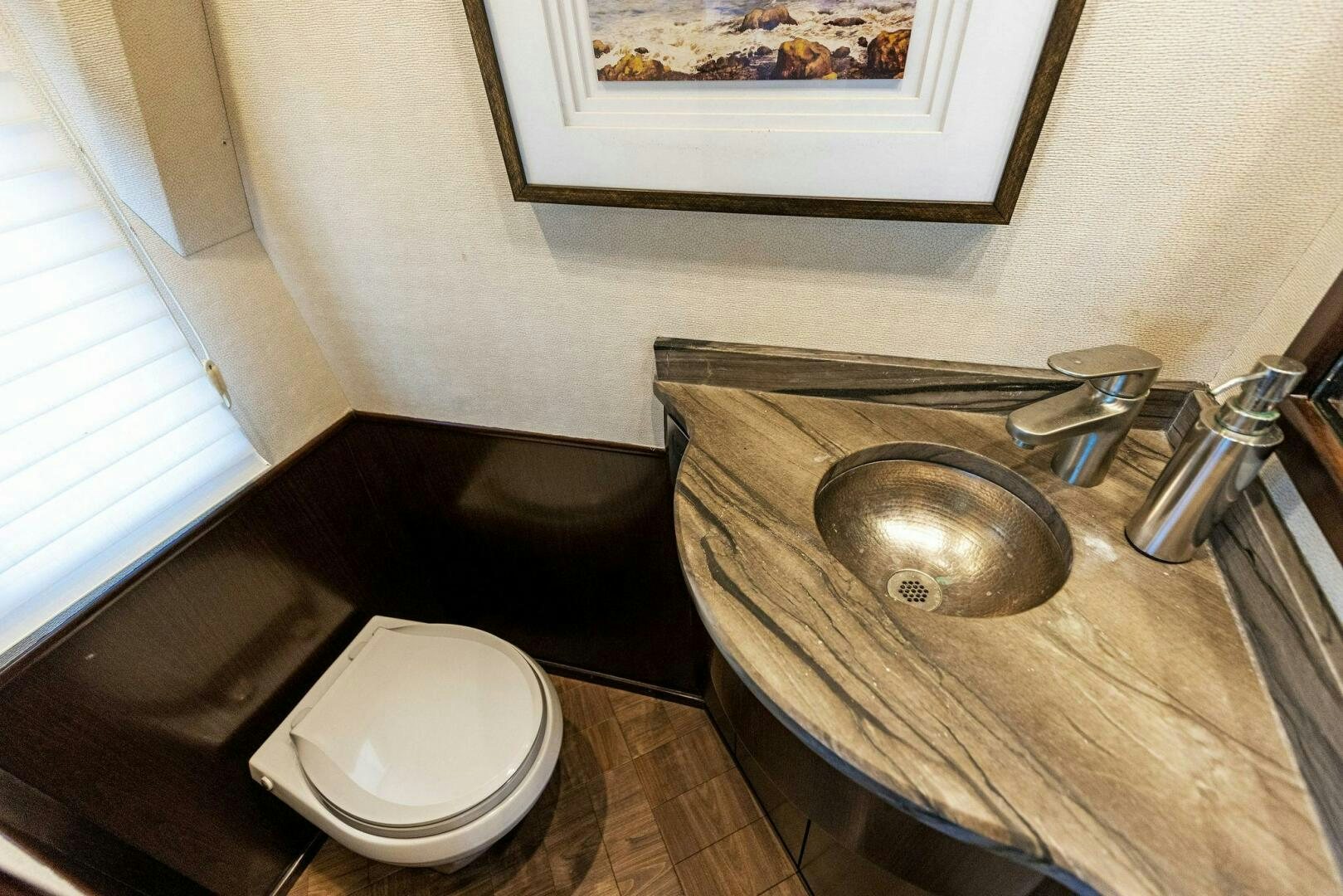 a bathroom sink with a toilet aboard THE PROVIDER Yacht for Sale