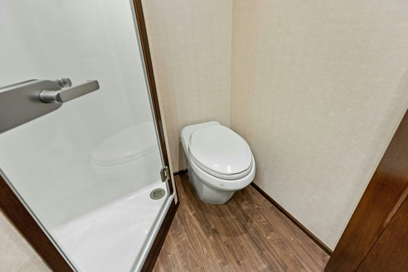 a bathroom with a toilet and a shower aboard THE PROVIDER Yacht for Sale