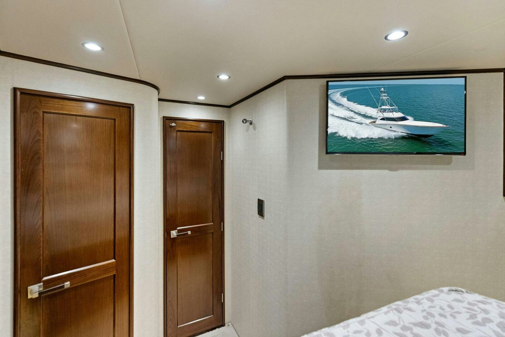 a bedroom with a painting on the wall aboard THE PROVIDER Yacht for Sale