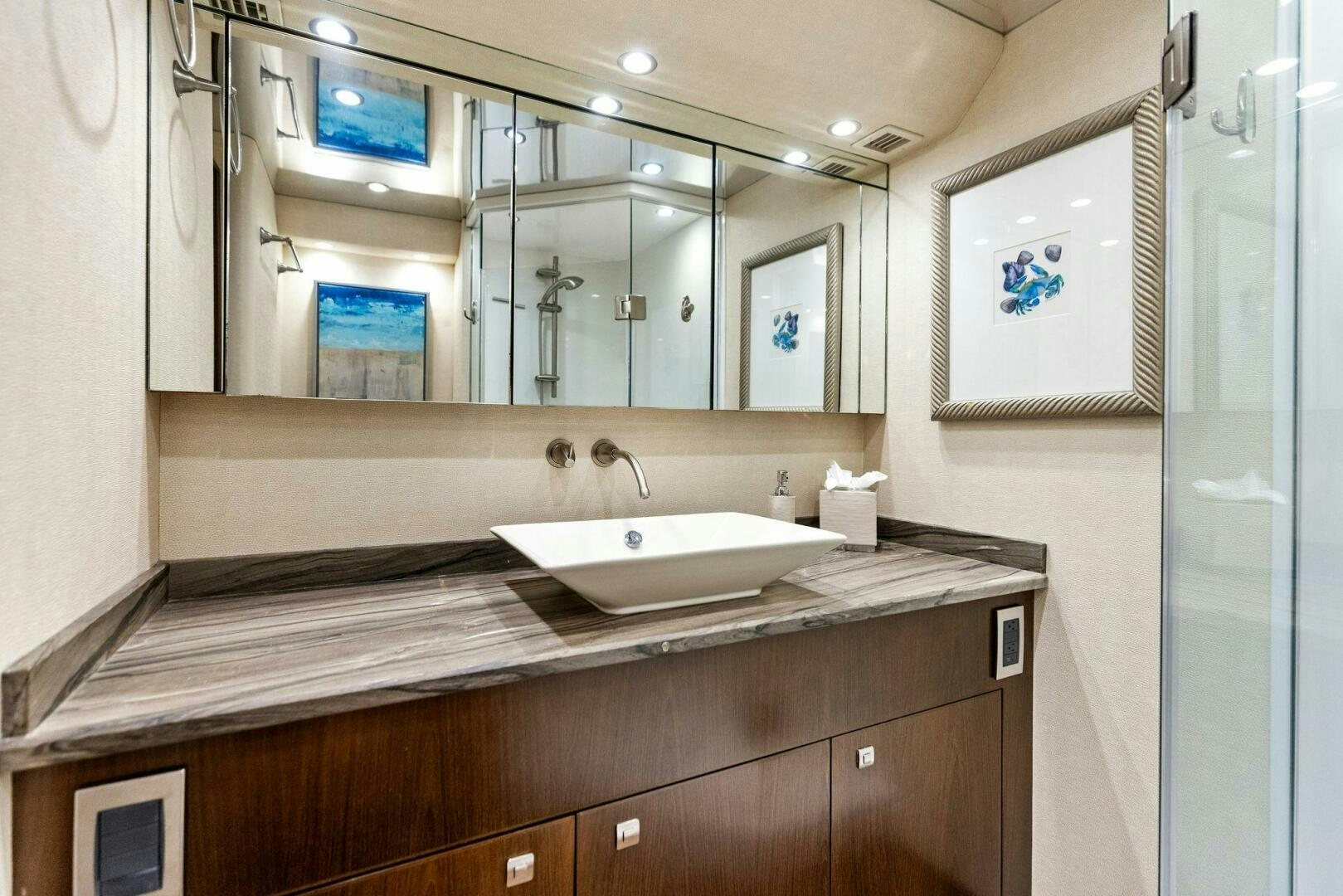 a bathroom with a large mirror aboard THE PROVIDER Yacht for Sale