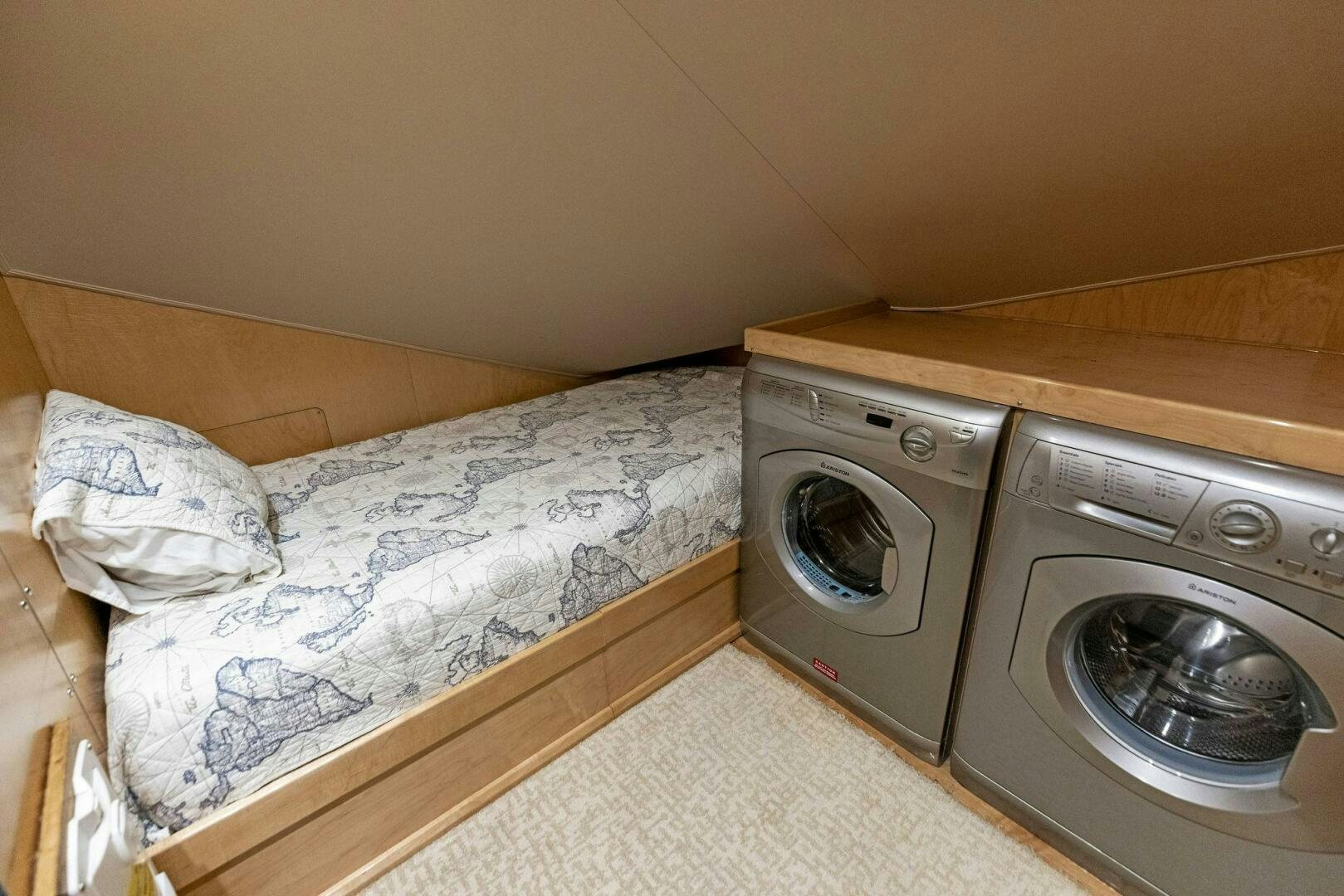 a bed and washer in a room aboard THE PROVIDER Yacht for Sale