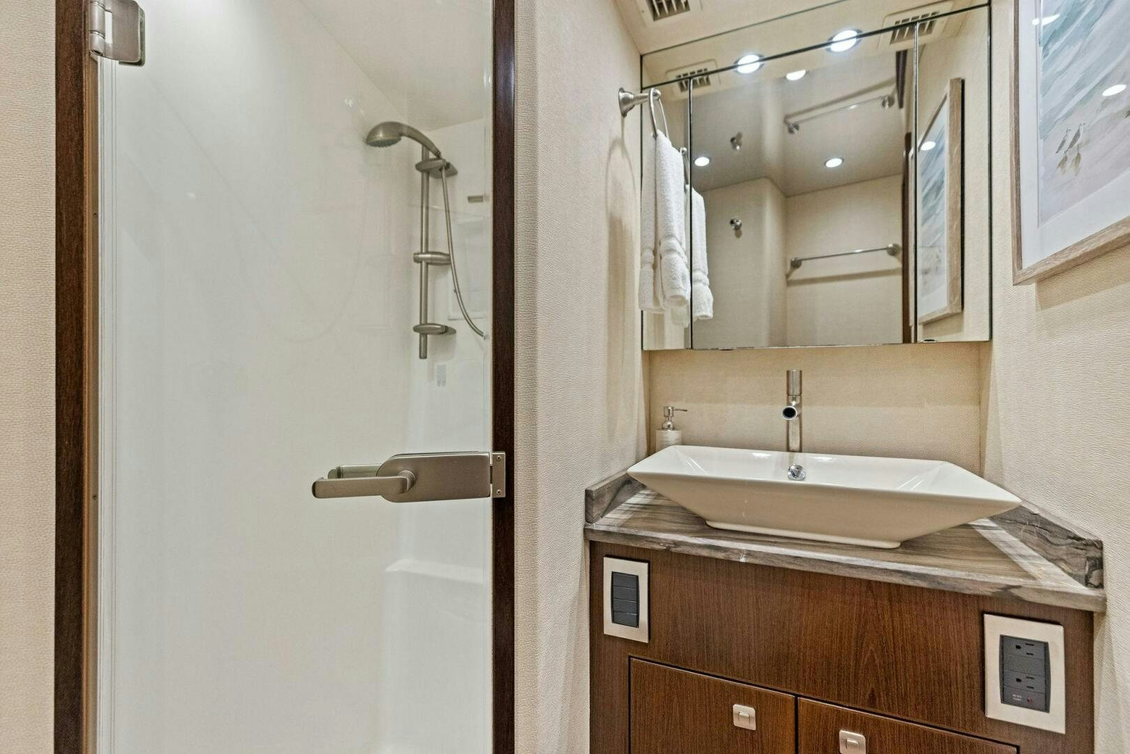 a bathroom with a sink and a mirror aboard THE PROVIDER Yacht for Sale
