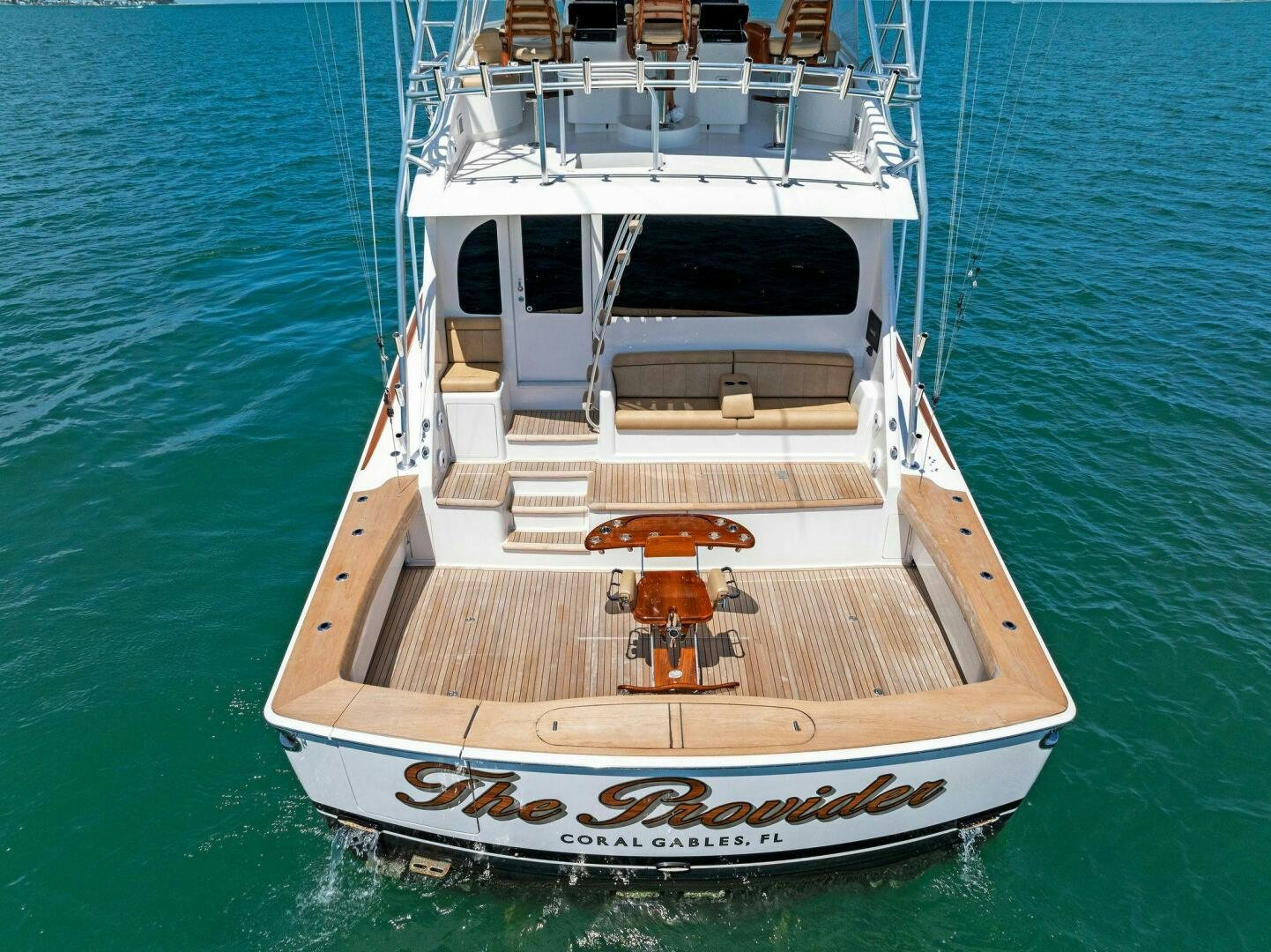 a white boat on the water aboard THE PROVIDER Yacht for Sale