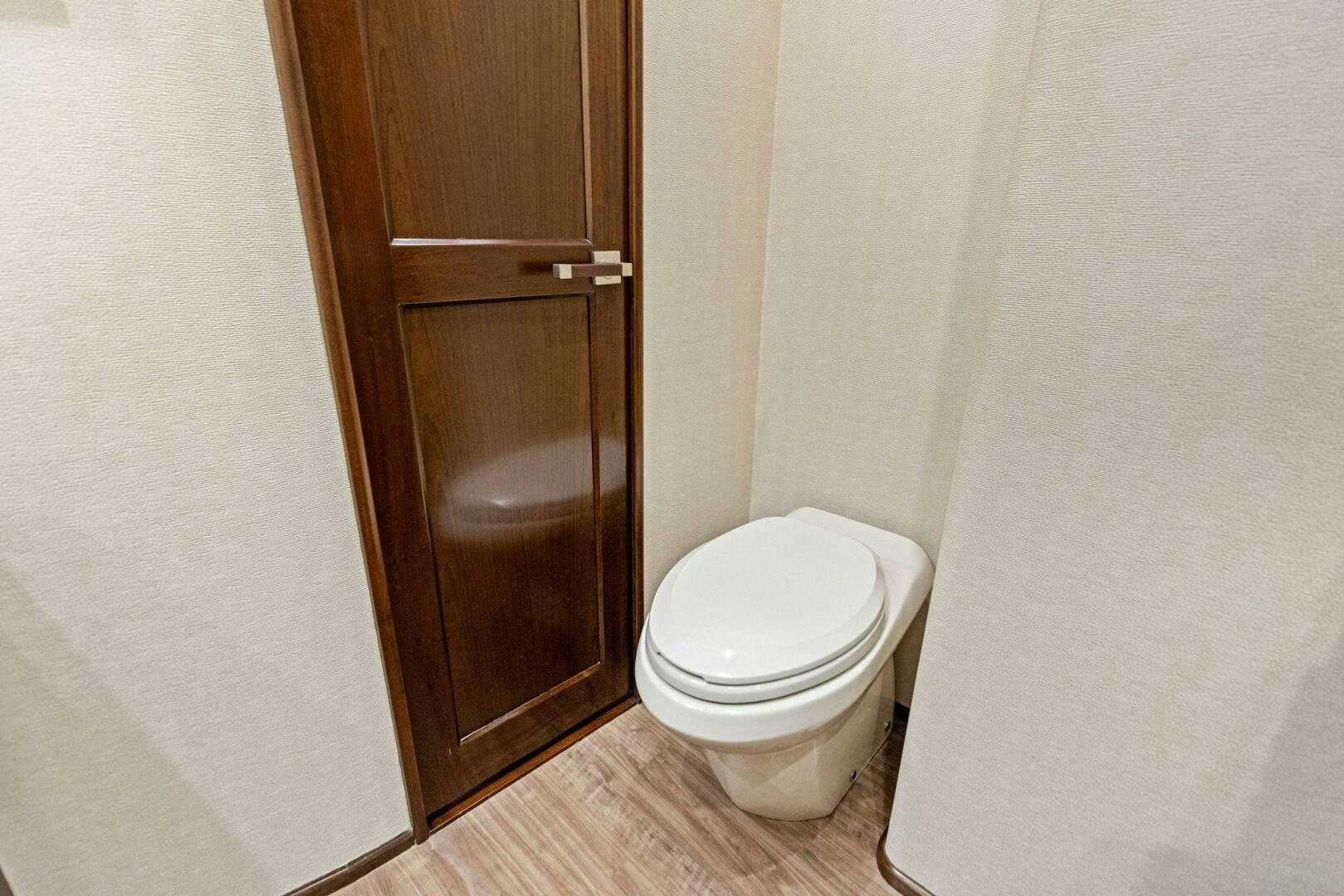 a toilet in a bathroom aboard THE PROVIDER Yacht for Sale