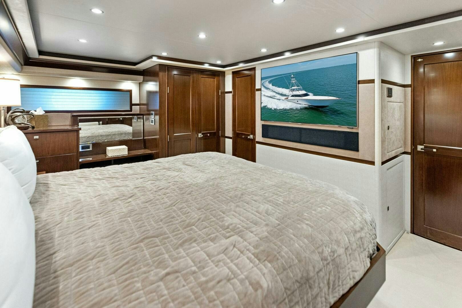 a large bedroom with a large television aboard THE PROVIDER Yacht for Sale