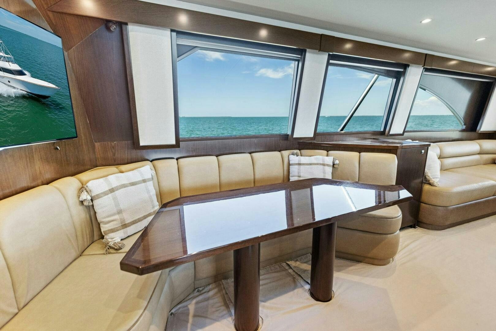 a room with a table and couches aboard THE PROVIDER Yacht for Sale