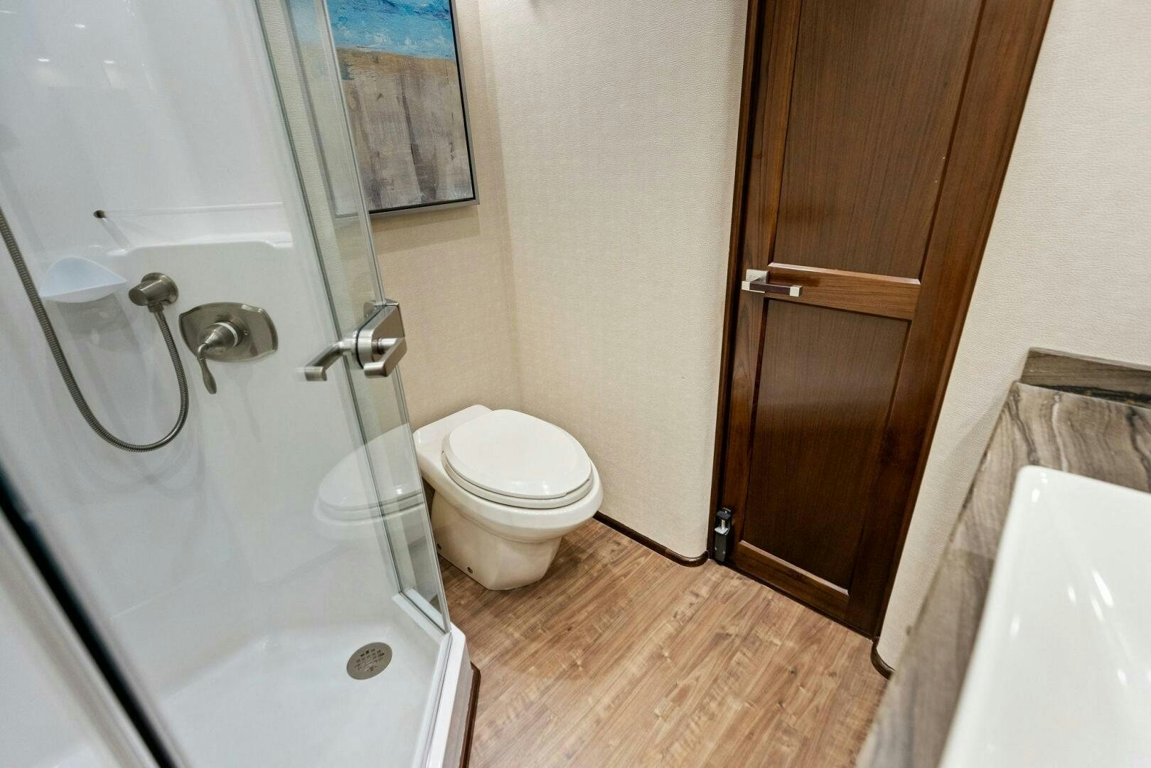 a bathroom with a toilet and a sink aboard THE PROVIDER Yacht for Sale