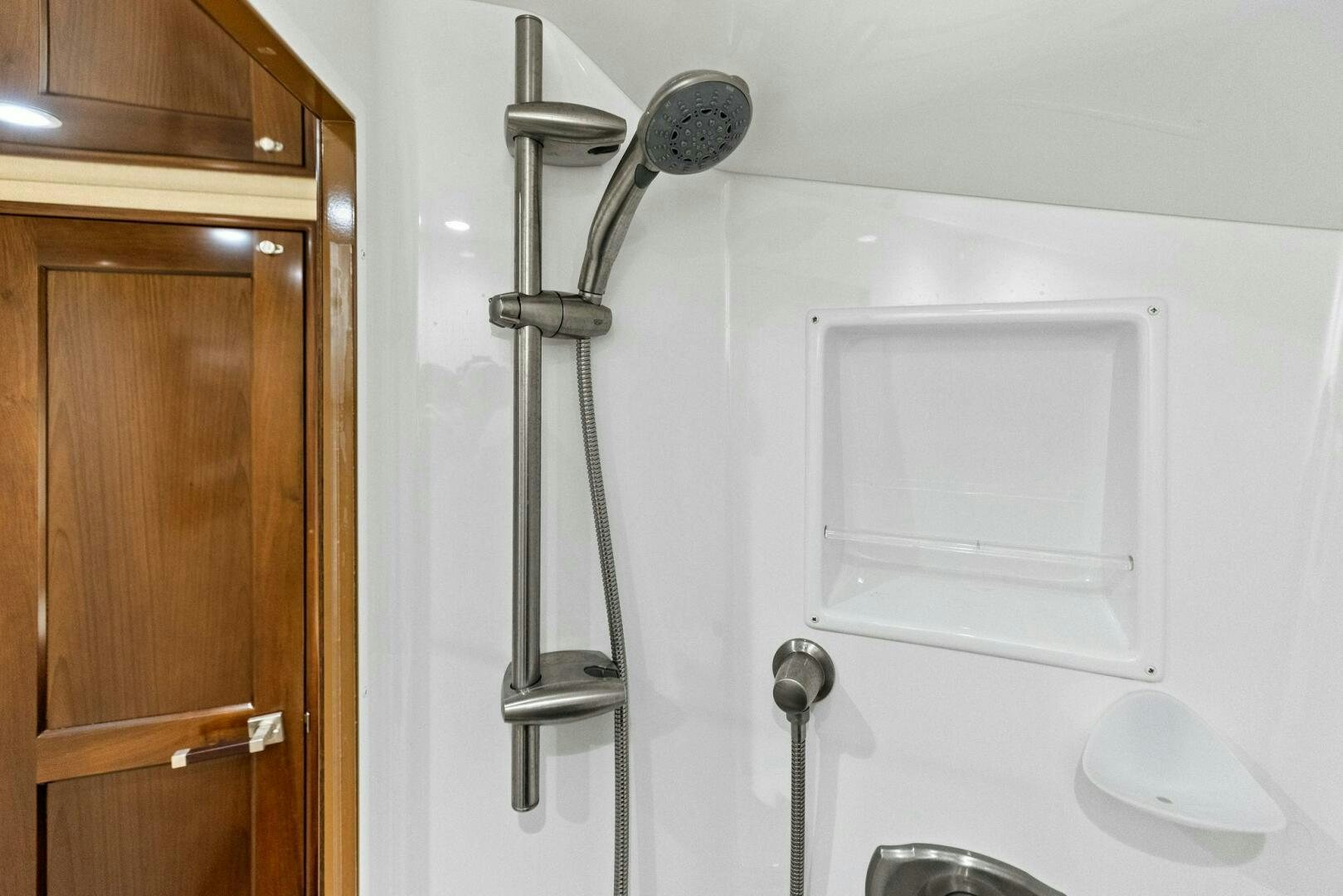 a shower with a sink and a mirror aboard THE PROVIDER Yacht for Sale