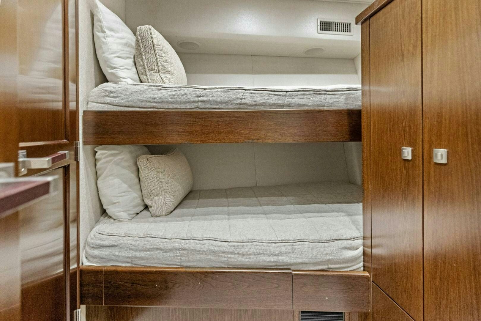 a bed with white sheets aboard THE PROVIDER Yacht for Sale