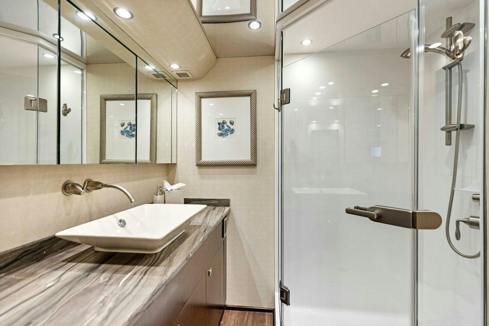 a bathroom with a large mirror aboard THE PROVIDER Yacht for Sale